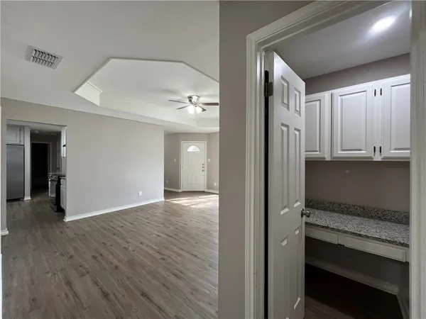 a view of a kitchen from the hallway
