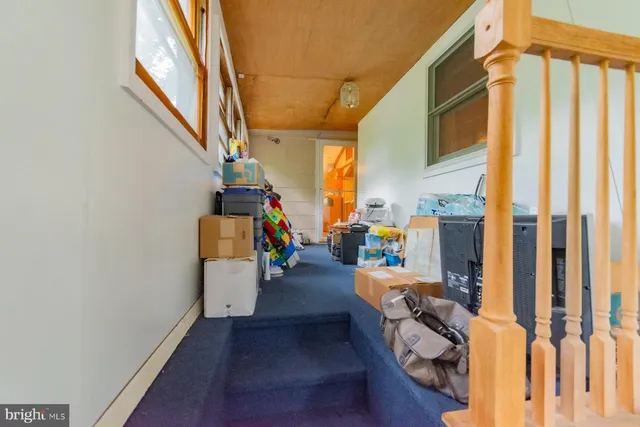 a view of living room with furniture and a window