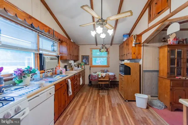 a kitchen with stainless steel appliances granite countertop lots of counter top space