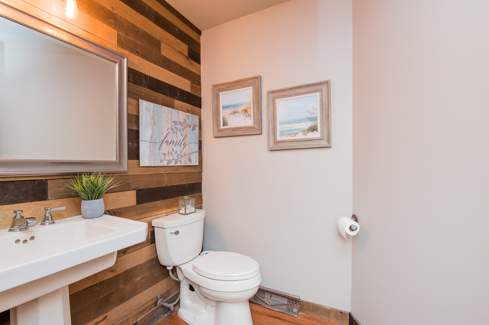 11-n060 Johnstoun Road Elgin, IL 60124 - Photo 22 of 44 a bathroom with a toilet a sink and mirror