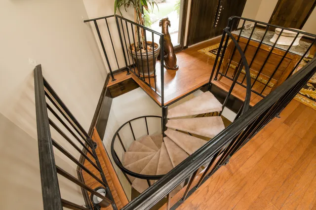 a view of staircase with black and white walls