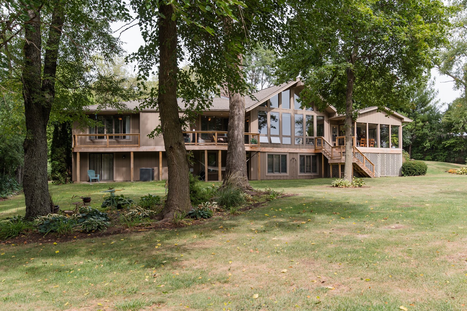 11-n060 Johnstoun Road Elgin, IL 60124 - Photo 8 of 44 a front view of a house with a garden