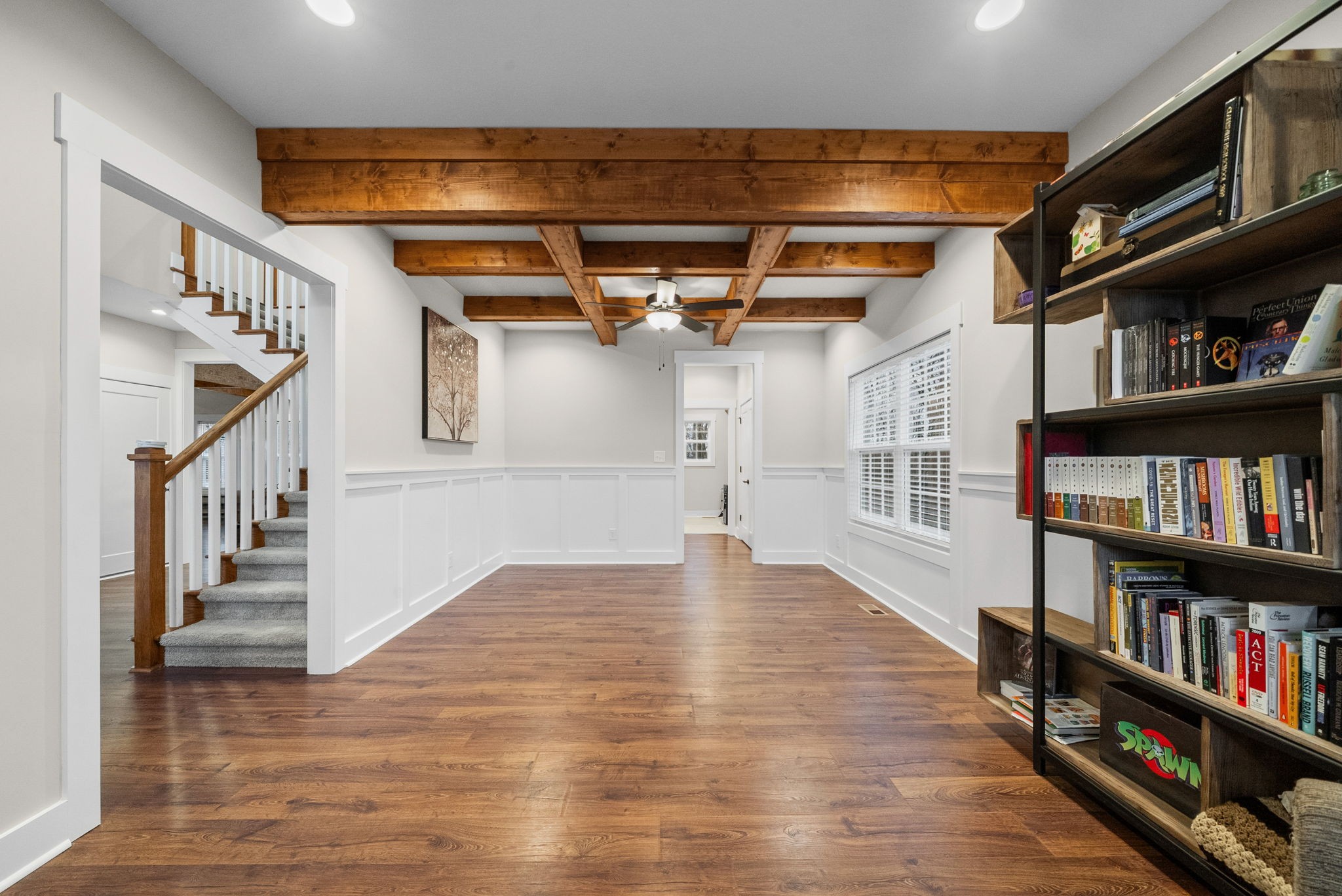 2854 Benton Ridge Road Palmyra, TN 37142 - Photo 24 of 64 a view of an empty room with wooden floor and stairs