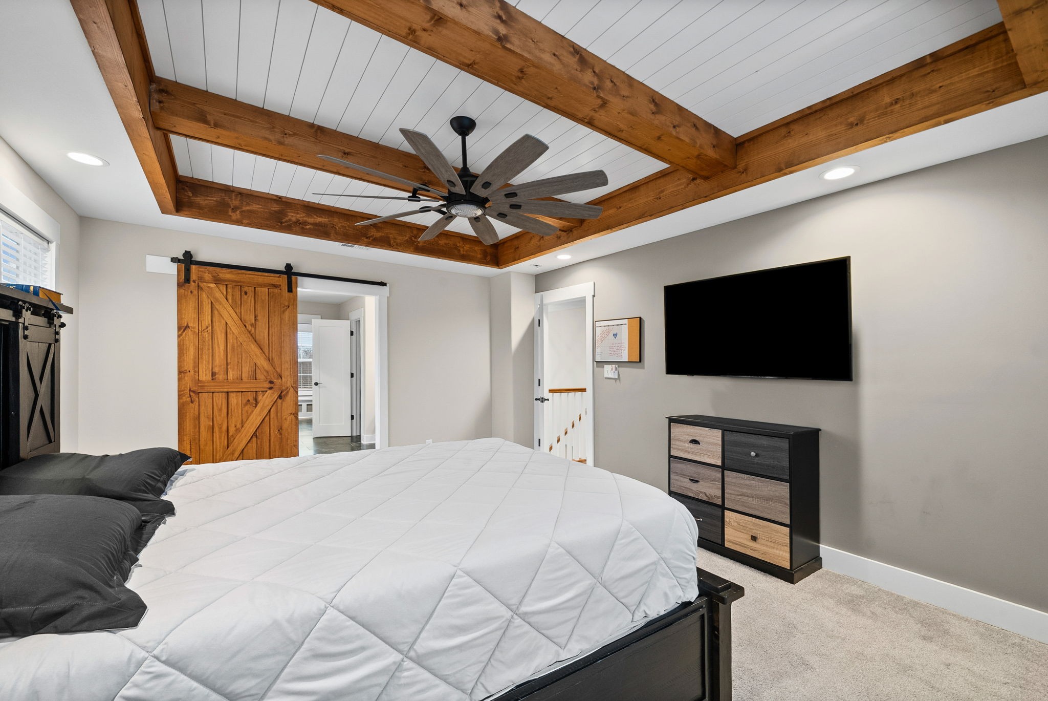 2854 Benton Ridge Road Palmyra, TN 37142 - Photo 30 of 64 a bedroom with a bed and a flat screen tv