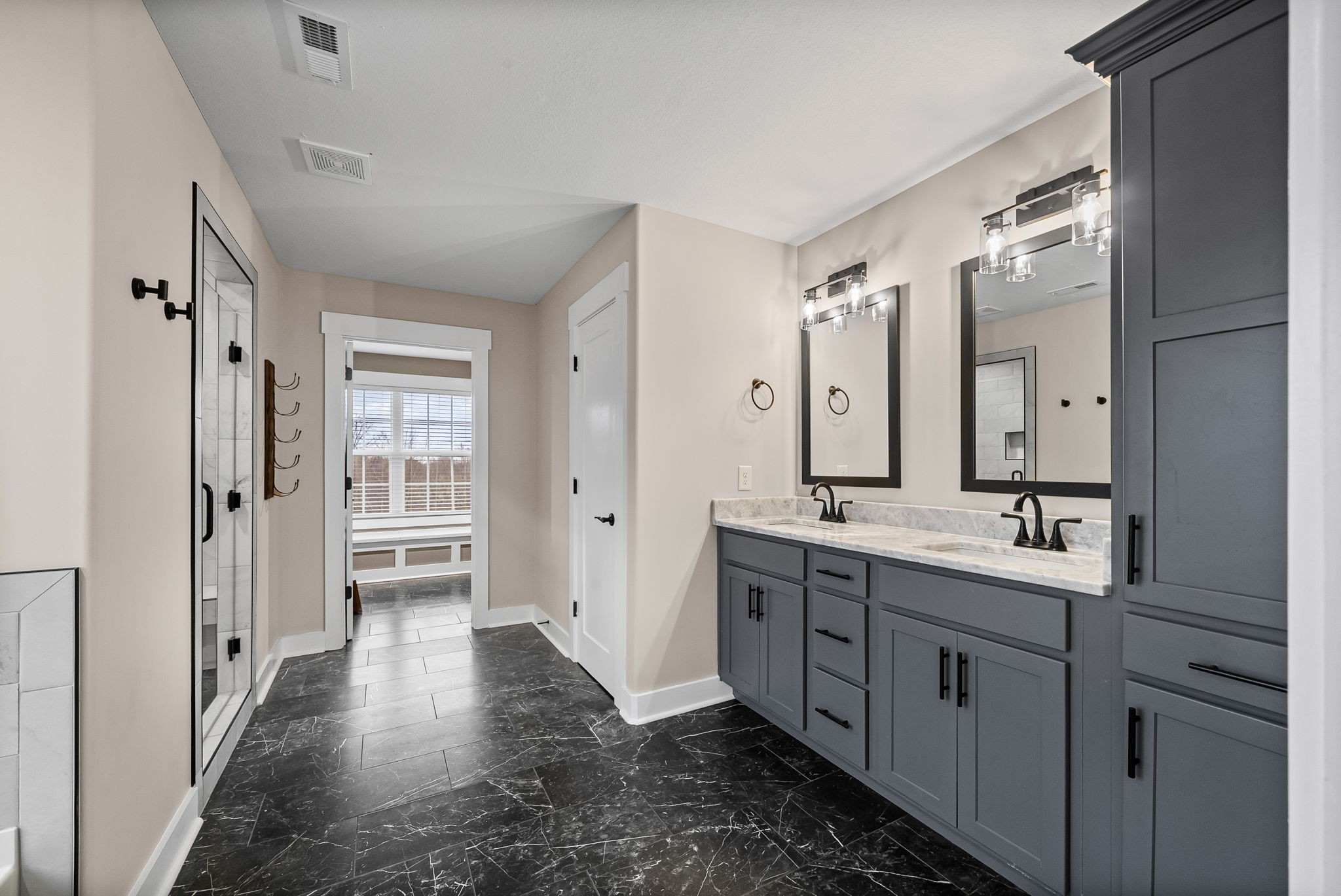 2854 Benton Ridge Road Palmyra, TN 37142 - Photo 31 of 64 a spacious bathroom with a double vanity sink a mirror and a shower