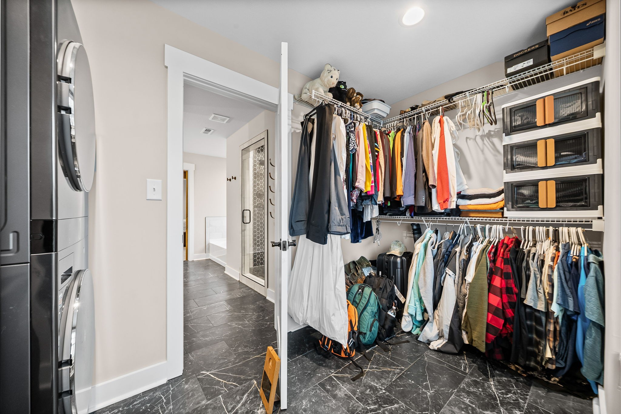 2854 Benton Ridge Road Palmyra, TN 37142 - Photo 38 of 64 a view of walk in closet with clothes and shoes