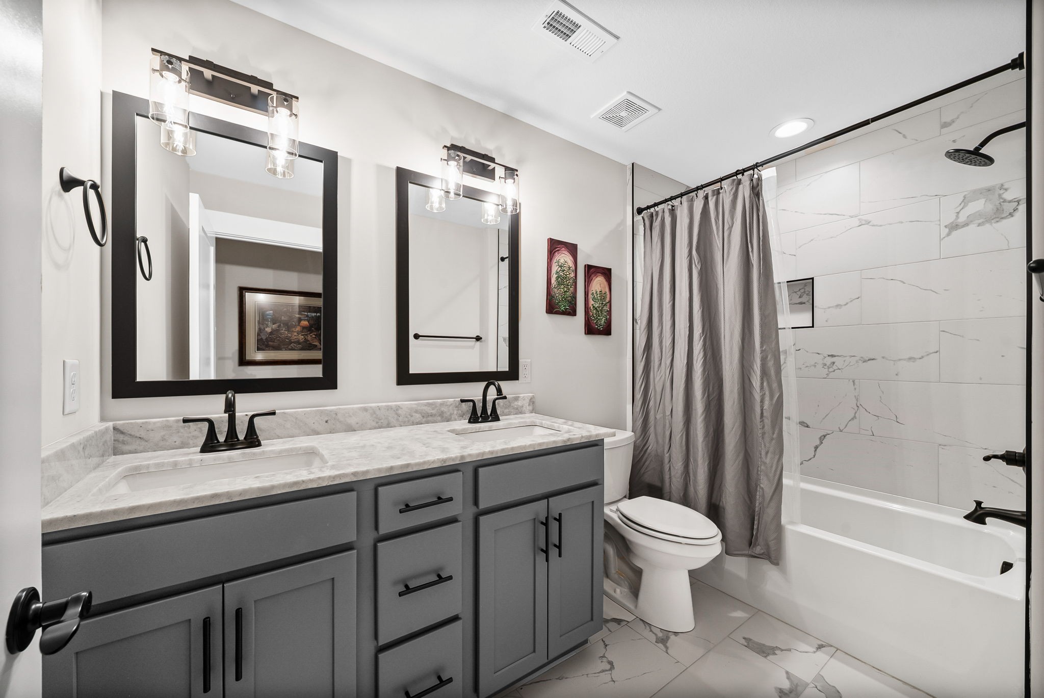 2854 Benton Ridge Road Palmyra, TN 37142 - Photo 41 of 64 a bathroom with a double vanity sink toilet mirror and shower