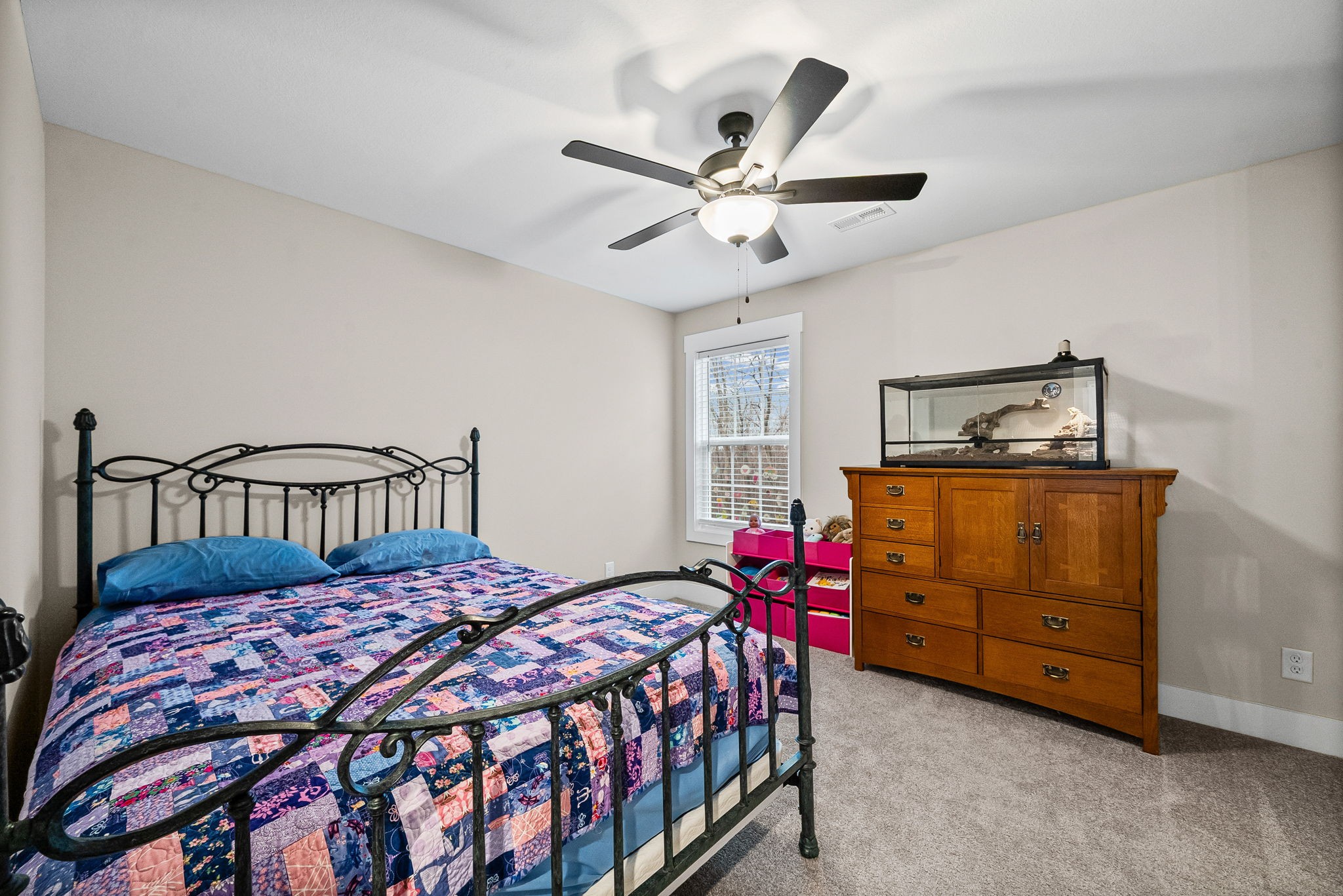 2854 Benton Ridge Road Palmyra, TN 37142 - Photo 46 of 64 a bedroom with a bed and a chandelier