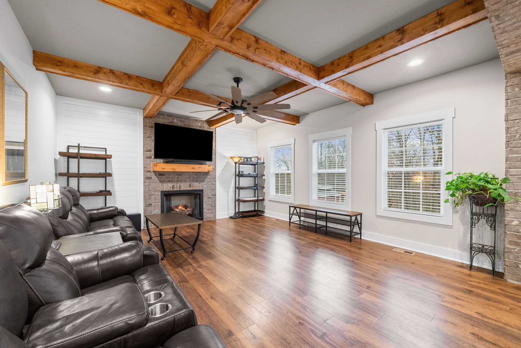2854 Benton Ridge Road Palmyra, TN 37142 - Photo 7 of 64 a living room with furniture a fireplace and a flat screen tv
