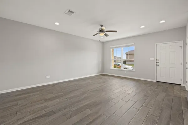 a view of an empty room with a window