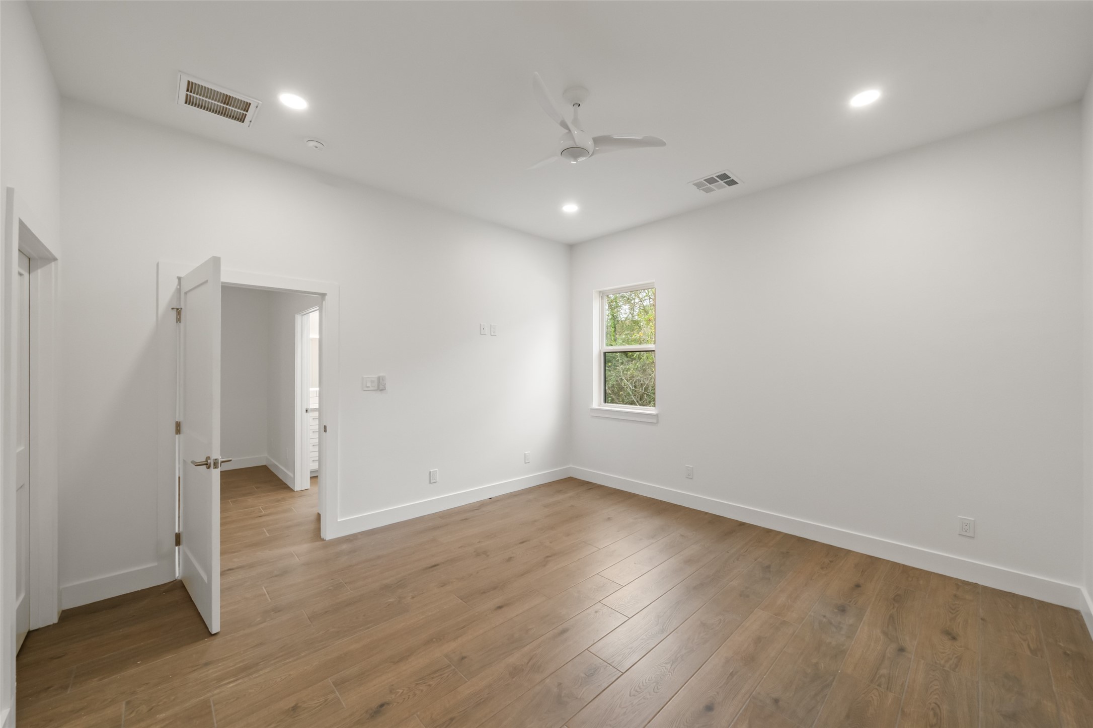 64 Gourd Creek Cemetary Road Huntsville, TX 77340 - Photo 14 of 34 an empty room with wooden floor and windows