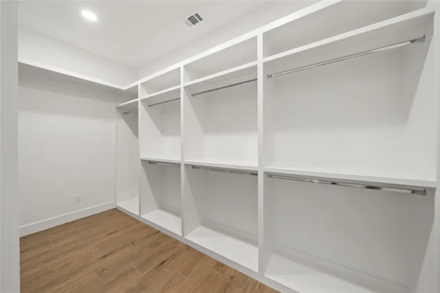 a view of an empty walk in closet