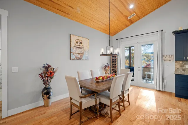 a dining room with furniture and wooden floor