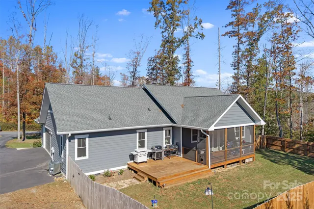 a view of house with yard porch and furniture