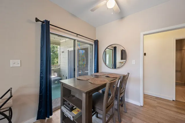 a kitchen with granite countertop a sink stove and cabinets