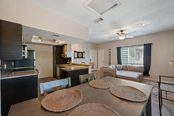 a view of a dining room with furniture window and wooden floor