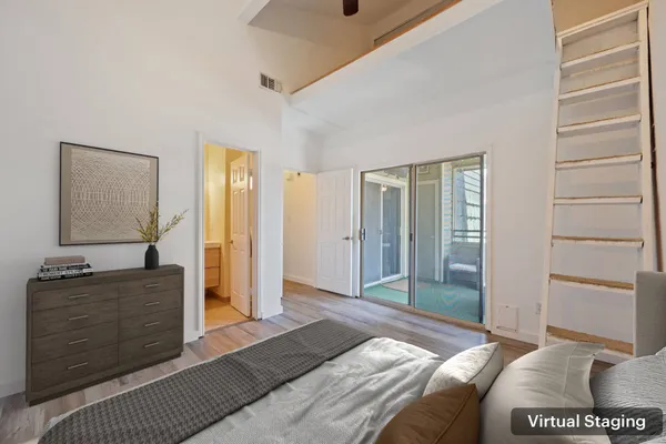 a living room with furniture and book shelf