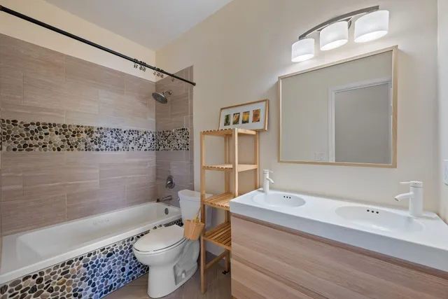 a bedroom with a bed and a dresser