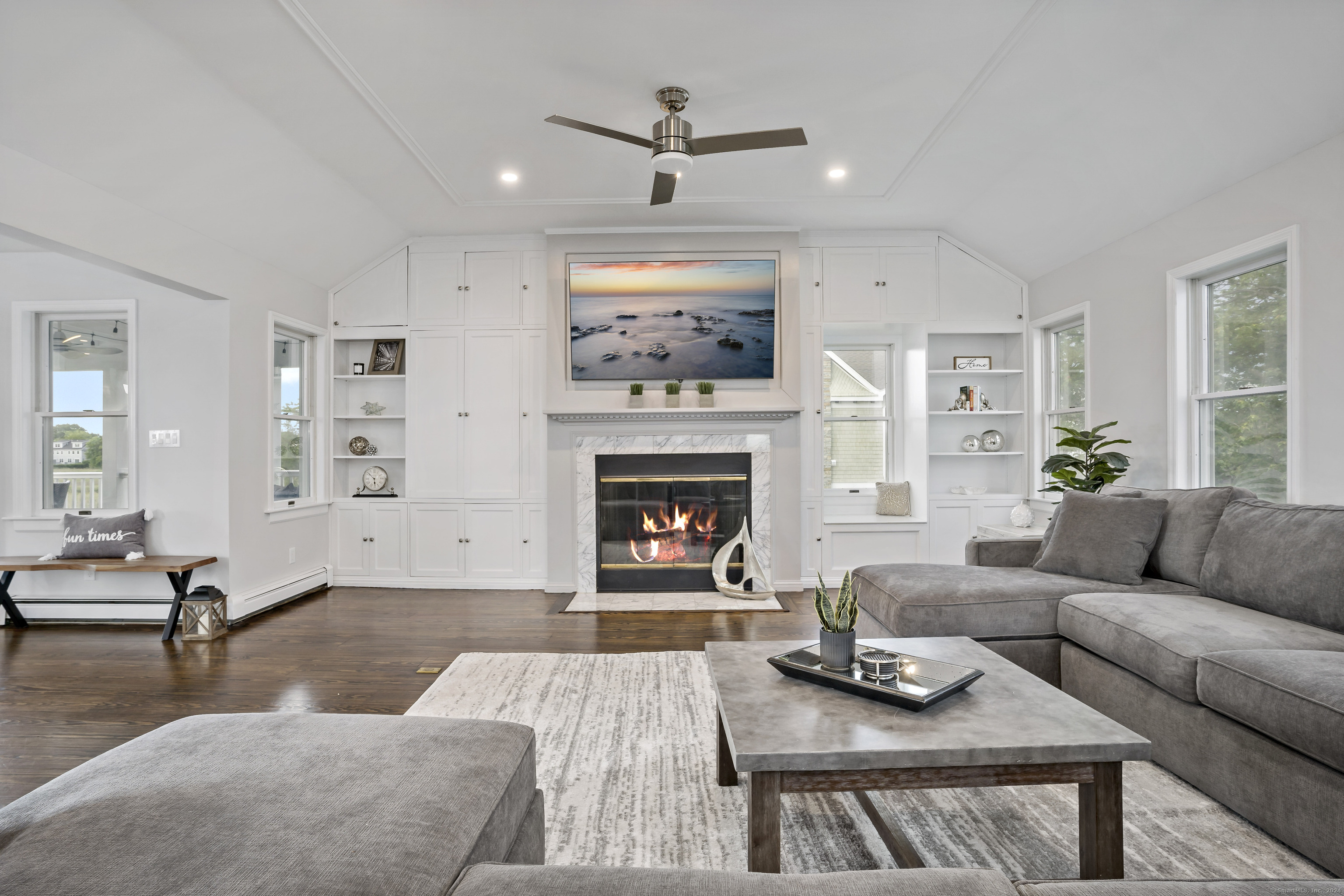 1016 Fairfield Beach Road Fairfield, CT 06824 - Photo 1 of 1 a living room with furniture and a fireplace