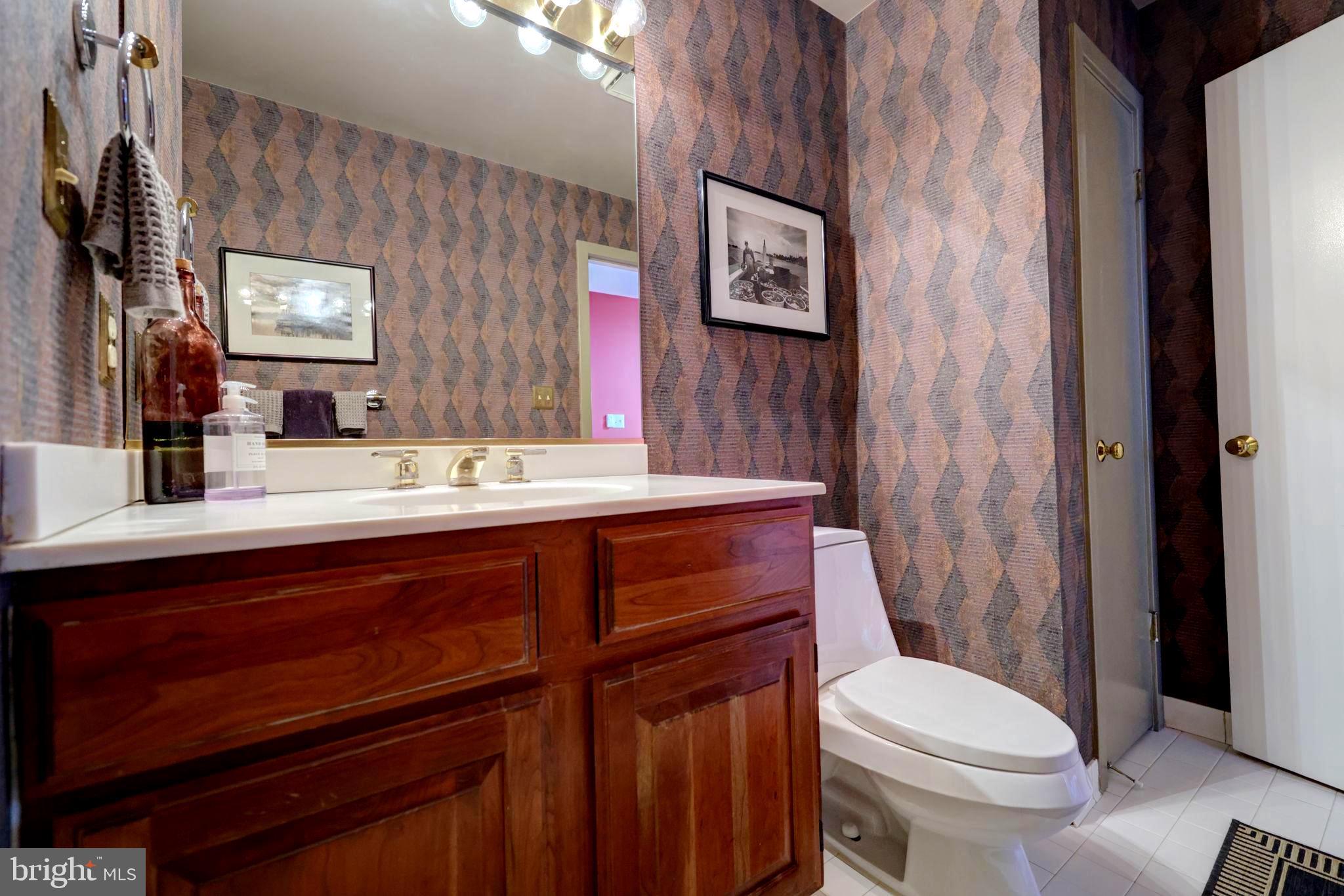 1410 Cedar Avenue McLean, VA 22101 - Photo 26 of 61 a bathroom with a sink a toilet a mirror and shower