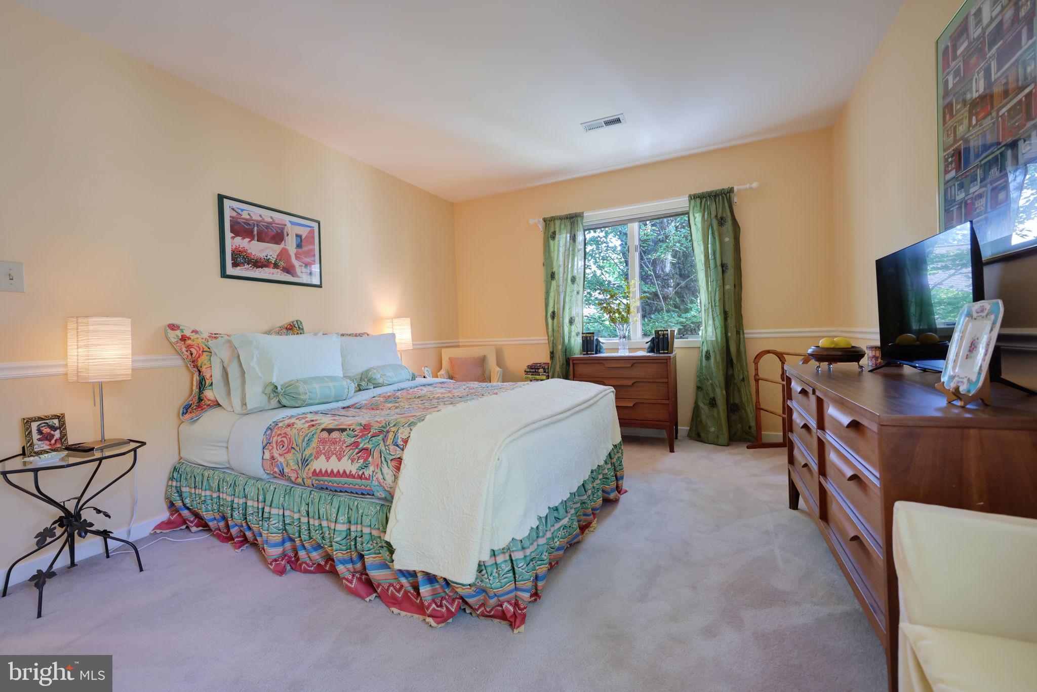 1410 Cedar Avenue McLean, VA 22101 - Photo 28 of 61 a bedroom with a bed and a flat screen tv
