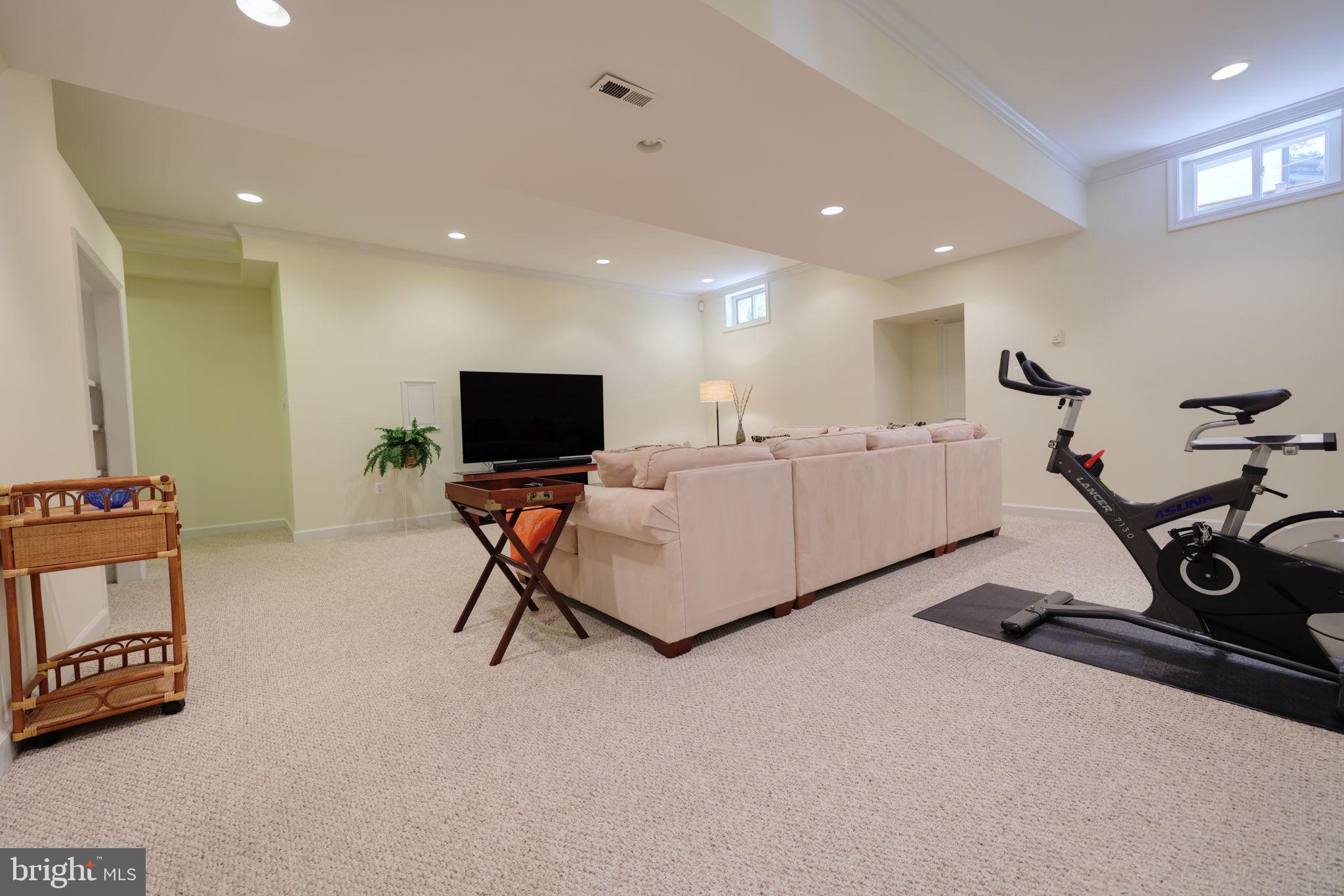 1410 Cedar Avenue McLean, VA 22101 - Photo 32 of 61 a room with furniture and a flat screen tv