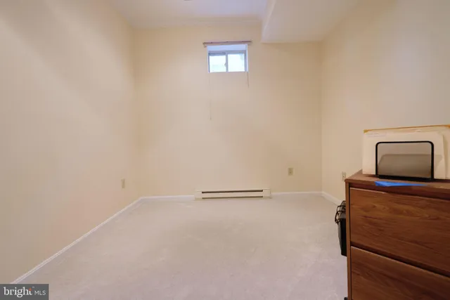 a livingroom with furniture and white walls