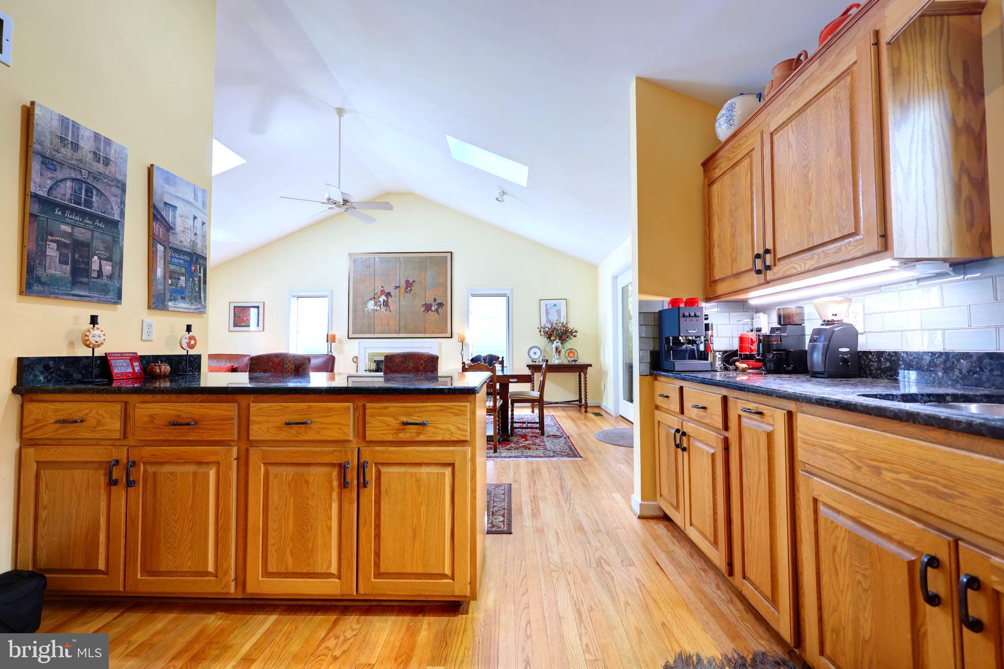 1410 Cedar Avenue McLean, VA 22101 - Photo 7 of 61 a kitchen with stainless steel appliances granite countertop wooden cabinets a sink and dishwasher a stove with wooden floor
