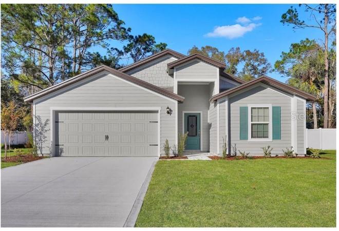 15271 Southwest 65th Ter Road Ocala, FL 34473 - Photo 1 of 1 a view of a house with yard and tree s
