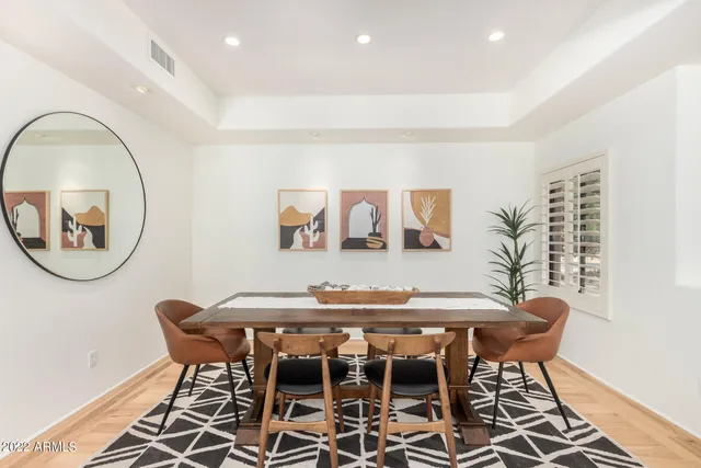 a view of a dining room with furniture and a table