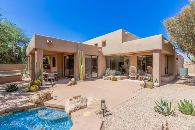 a view of a dinning table and chairs in patio