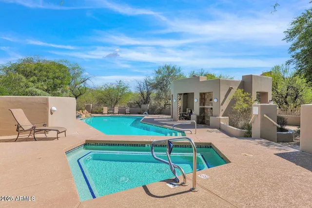 a view of a patio with swimming pool