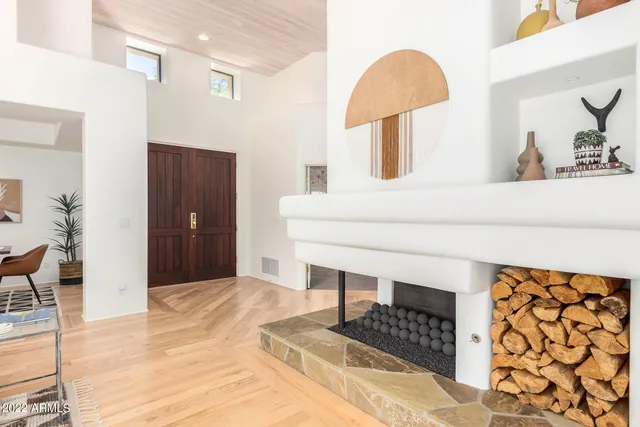 a bedroom with a bed and a lamp on table