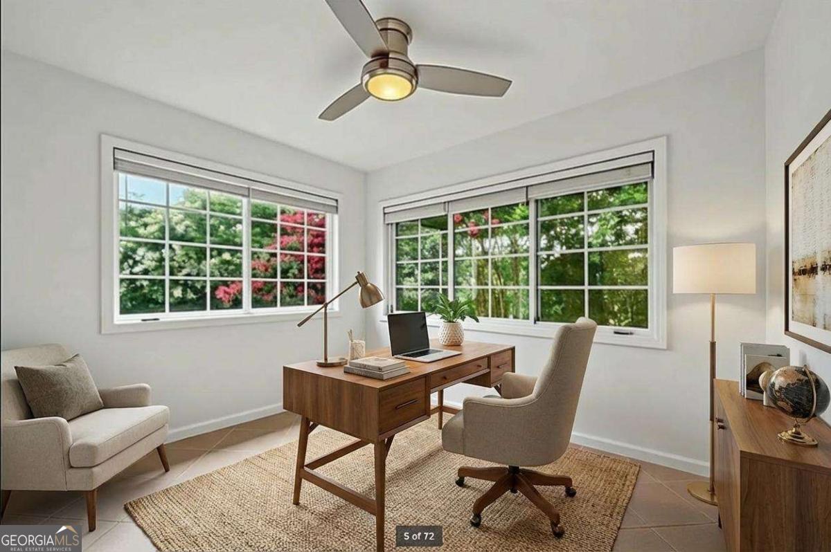 1468 Briarwood Road Northeast, Unit 108 Atlanta, GA 30319 - Photo 3 of 5 a work room with furniture and a window