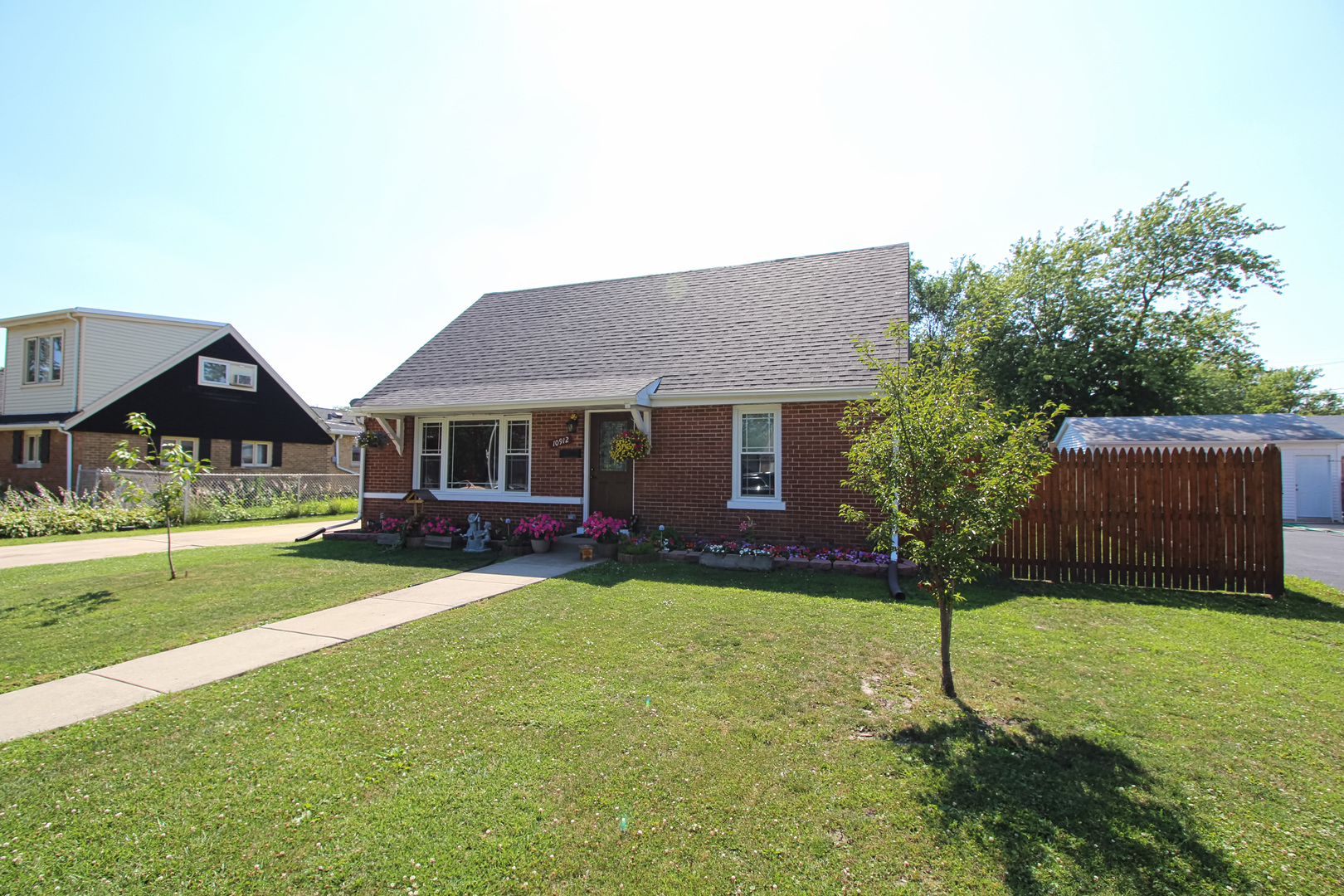 10912 Parkside Avenue Chicago Ridge, IL 60415 - Photo 1 of 1 a front view of a house with a yard and porch