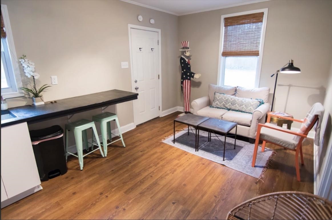 699 Shotwell Street Memphis, TN 38111 - Photo 26 of 33 Living area with wood finished floors and ornamental molding