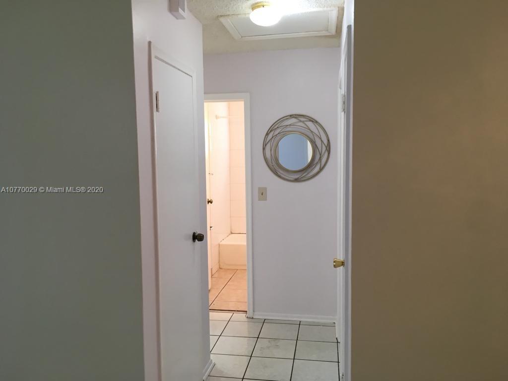 6301 Raleigh Street Hollywood, FL 33024 - Photo 12 of 19 a view of a bathroom with a sink