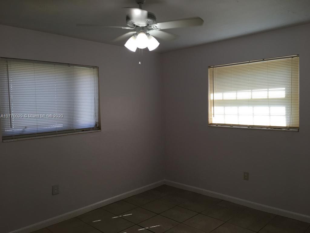6301 Raleigh Street Hollywood, FL 33024 - Photo 13 of 19 an empty room with a window