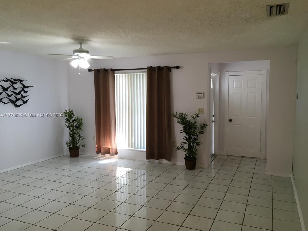 6301 Raleigh Street Hollywood, FL 33024 - Photo 6 of 19 a view of an empty room and window