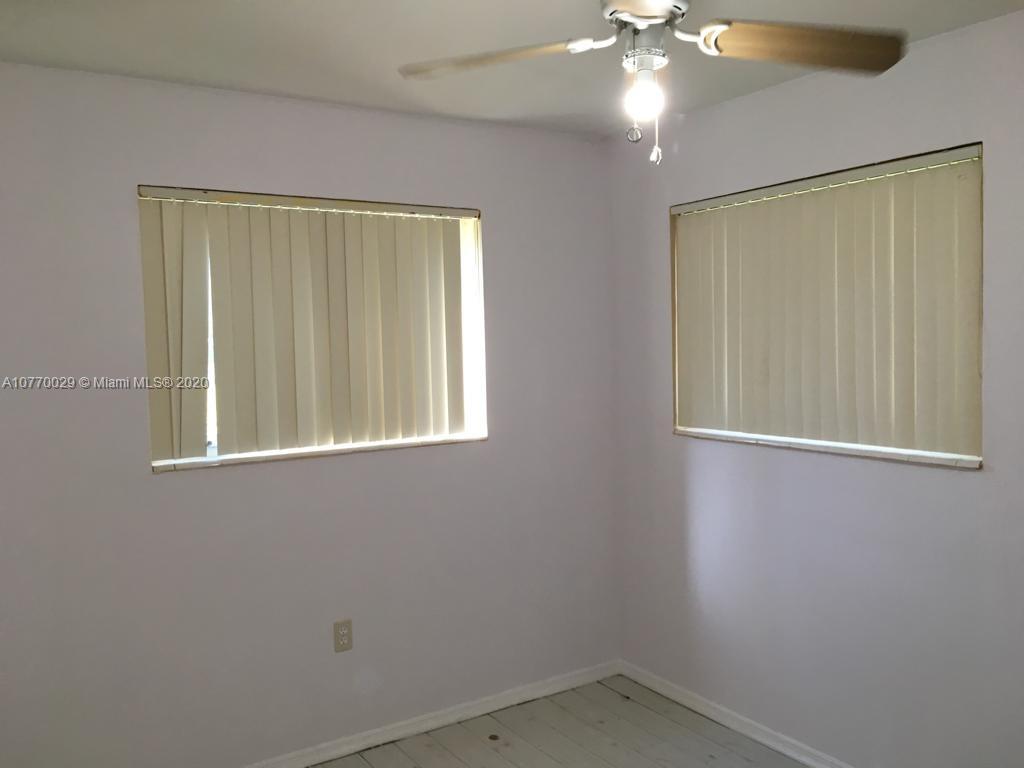 6301 Raleigh Street Hollywood, FL 33024 - Photo 8 of 19 an empty room with a window