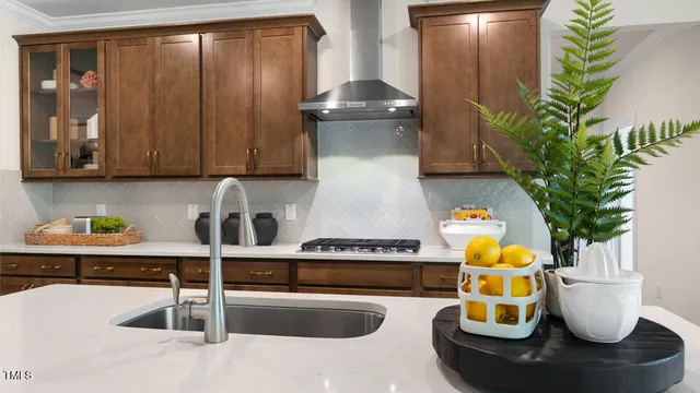 a kitchen with a refrigerator and a sink