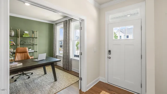 a view of a workspace room with wooden floor windows and wooden floor