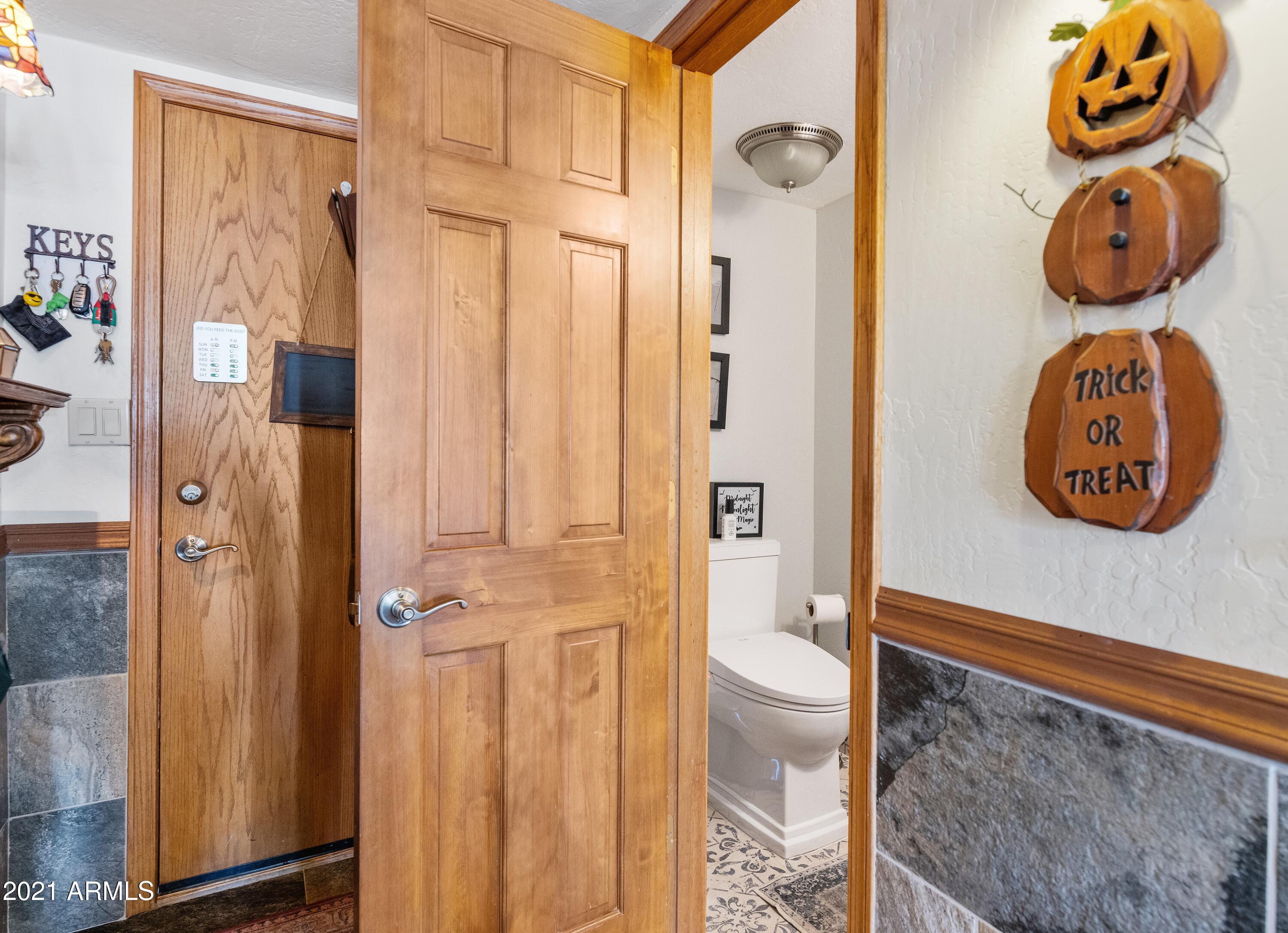 145 North Riata Street Gilbert, AZ 85234 - Photo 26 of 62 Powder Room Off Garage Hallway to Kitche