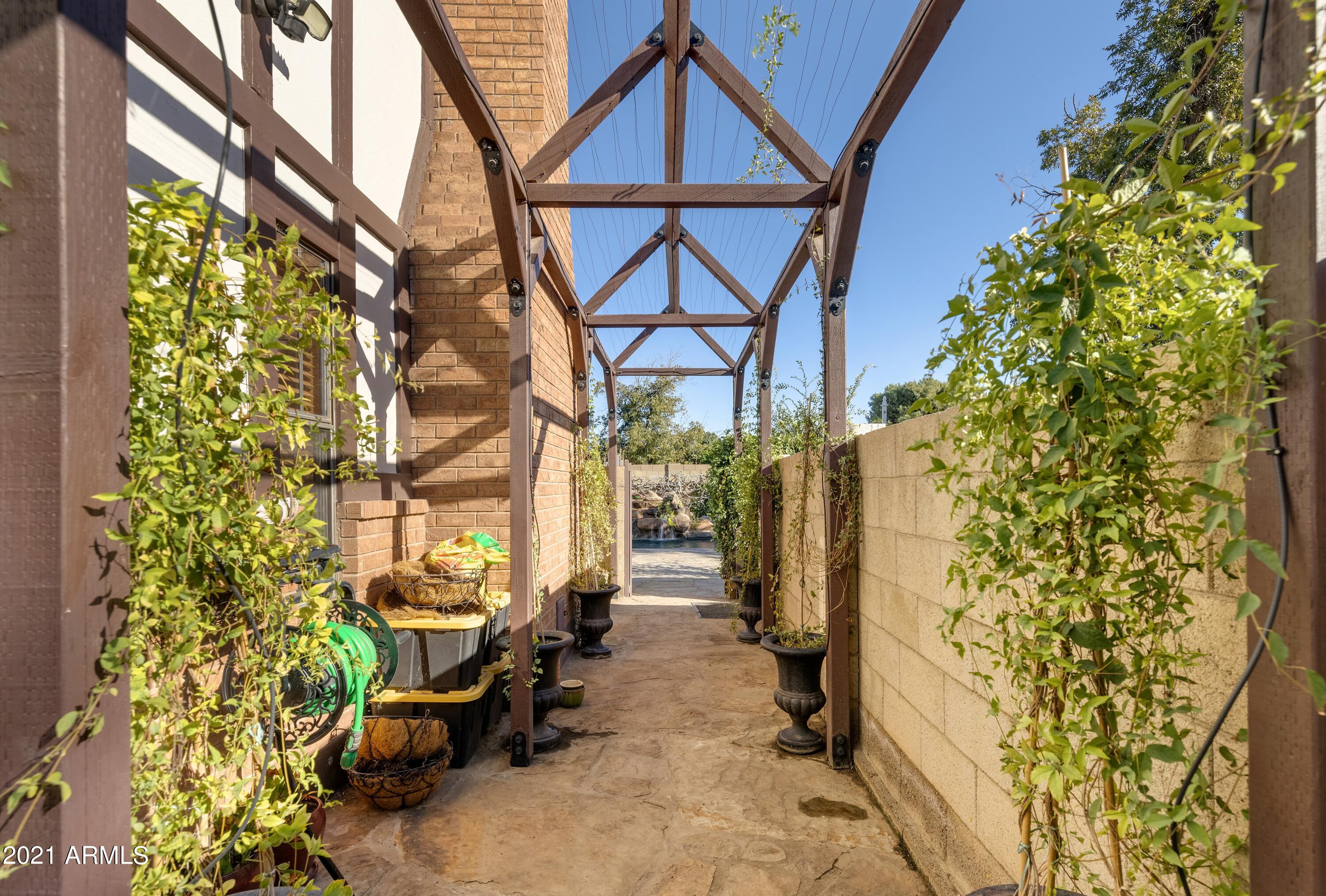 145 North Riata Street Gilbert, AZ 85234 - Photo 42 of 62 Trellis to Backyard