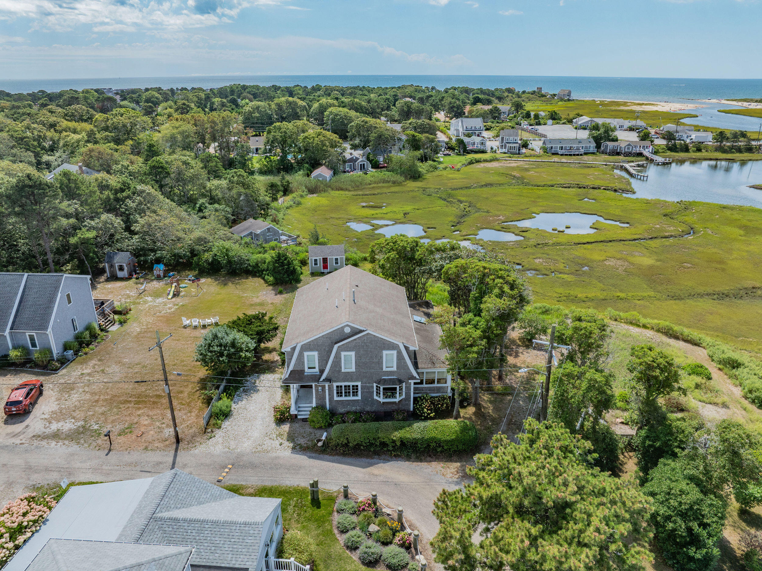 27 Mayflower Lane Dennis Port, MA 02639 - Photo 2 of 35 a aerial view of a house with a garden and lake view