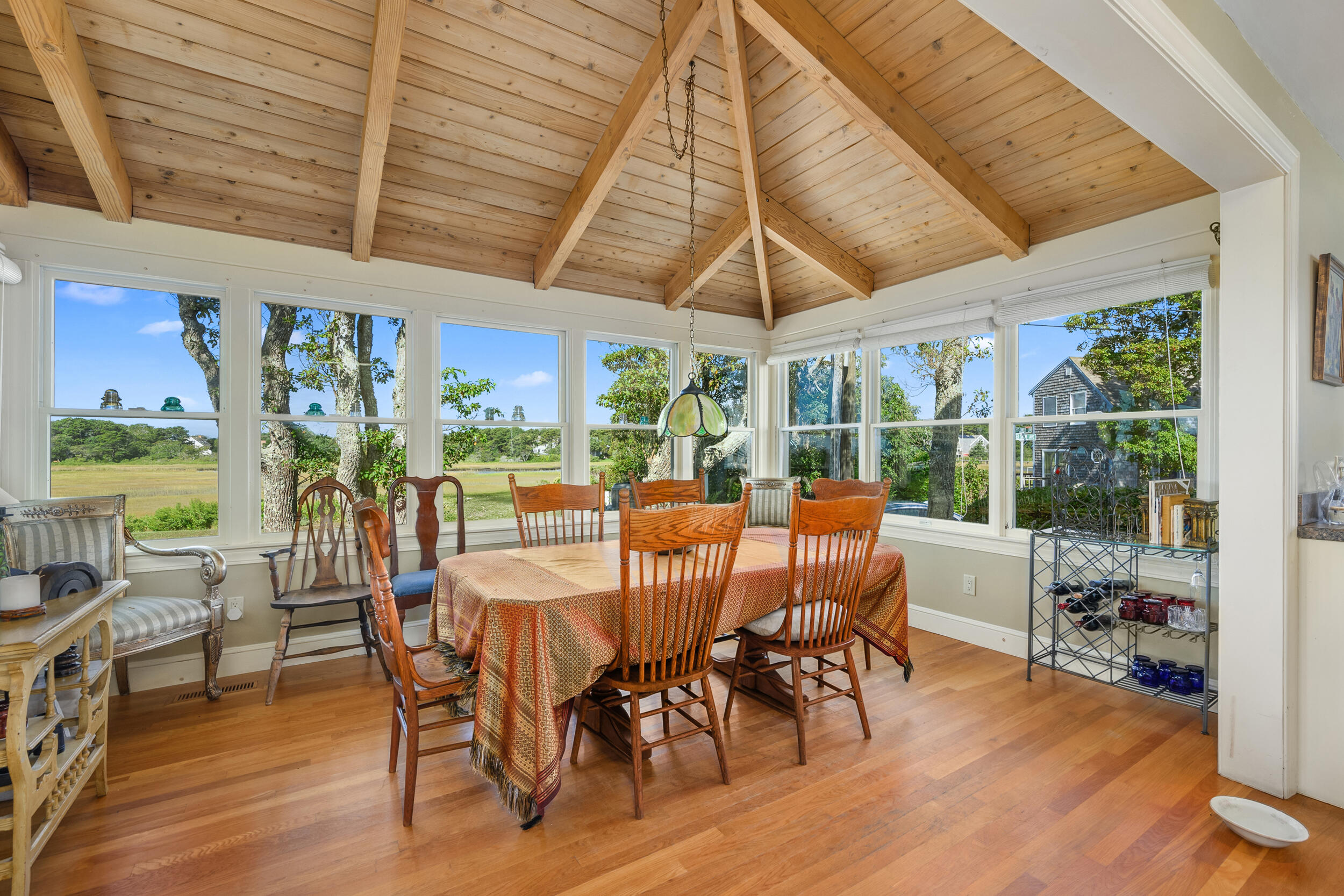 27 Mayflower Lane Dennis Port, MA 02639 - Photo 28 of 35 a view of a dining room with furniture window and outside view