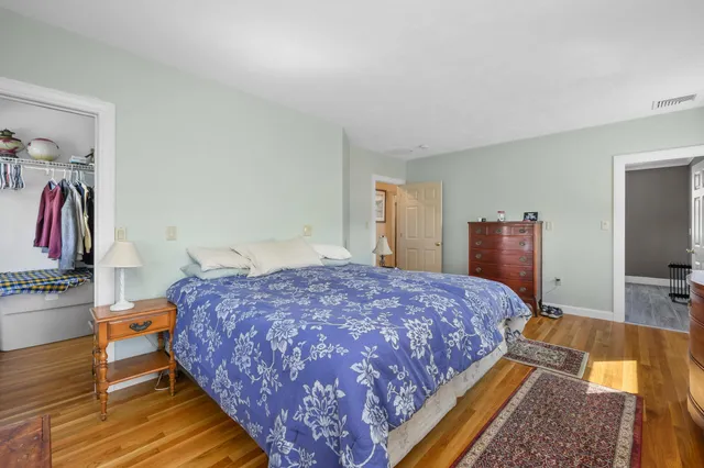 a bedroom with a bed and a flat screen television