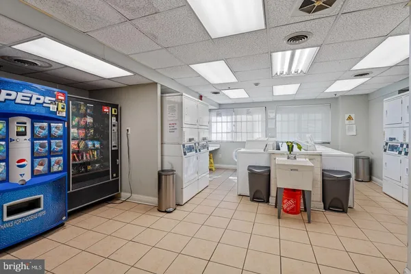a kitchen with stainless steel appliances granite countertop a refrigerator and a stove