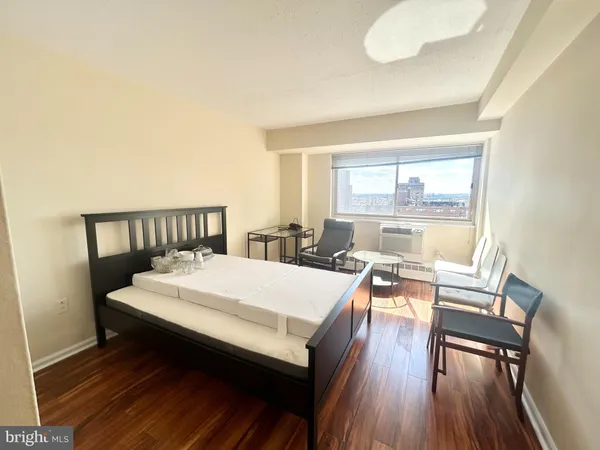 a large white bed in a white room