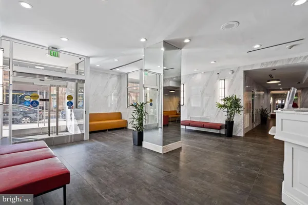 a lobby with furniture and a gym equipment